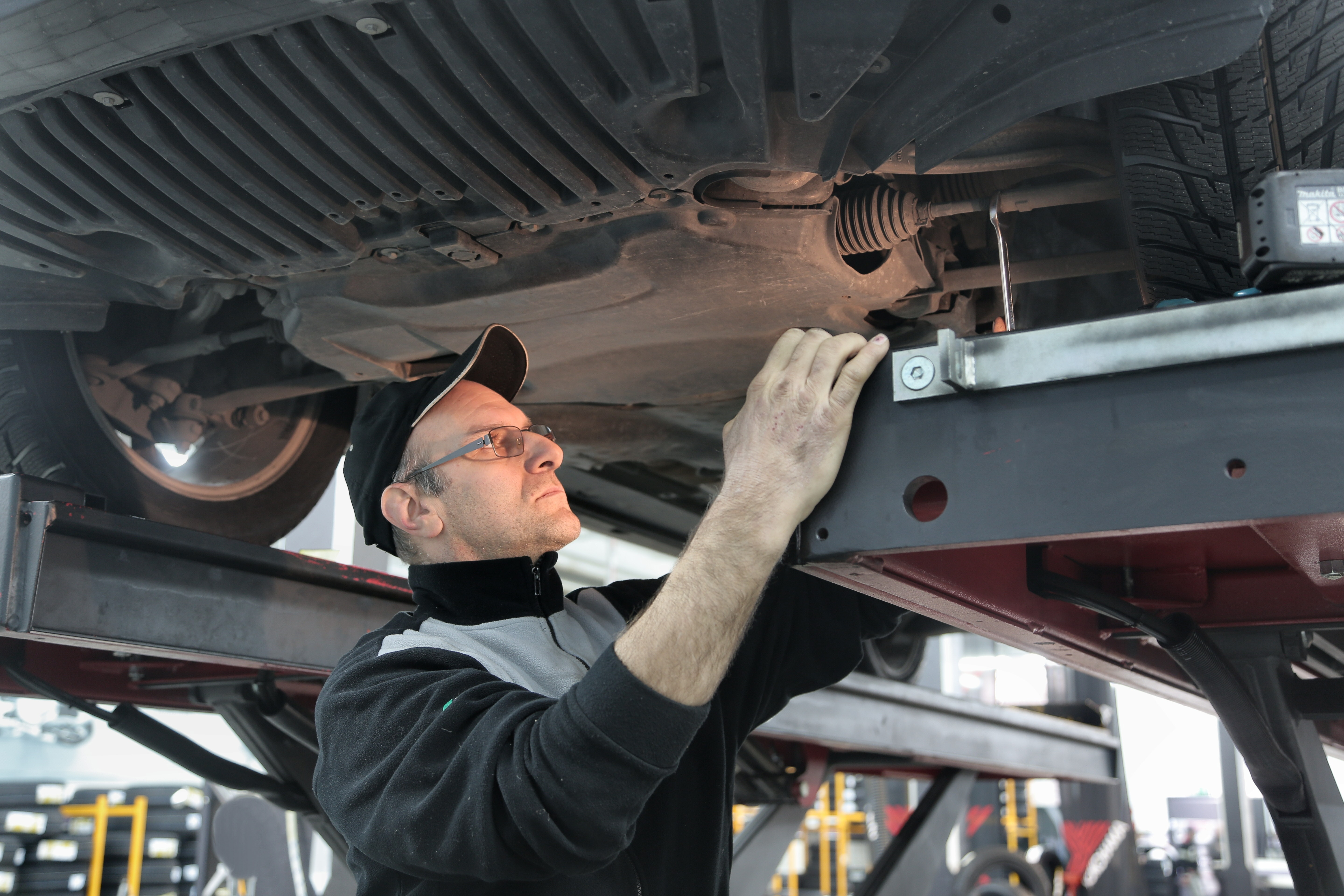 Mechanic Inspects Car