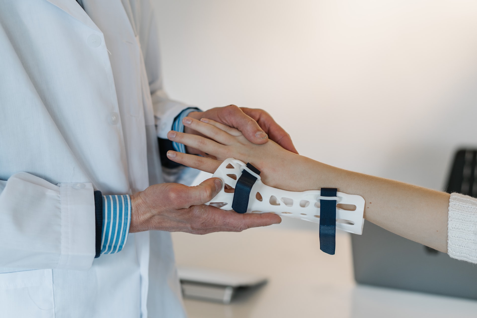 Doctor Putting Splint On Patient